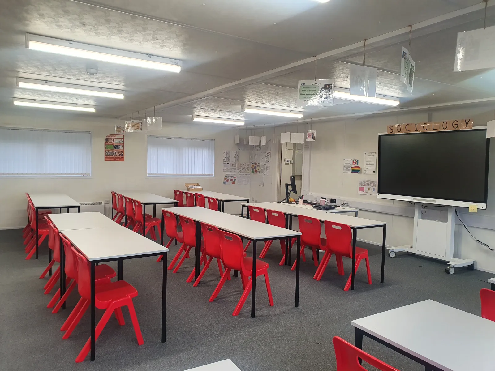 Modular Classrooms and Education, brightly lit classroom with student chairs and tables